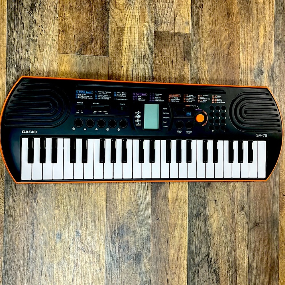Casio SA-76 44 key mini keyboard in orange